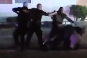 Here We Go Again: Video Shows Michigan Cop Repeatedly Punching Black Woman in the Head