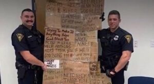 Alabama Police Poses With 'Quilt' Made from Signs of the Homeless