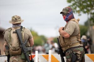 Armed White Supremacists and Counter-Protestors Violently Clash in Michigan and Georgia as Police Standby