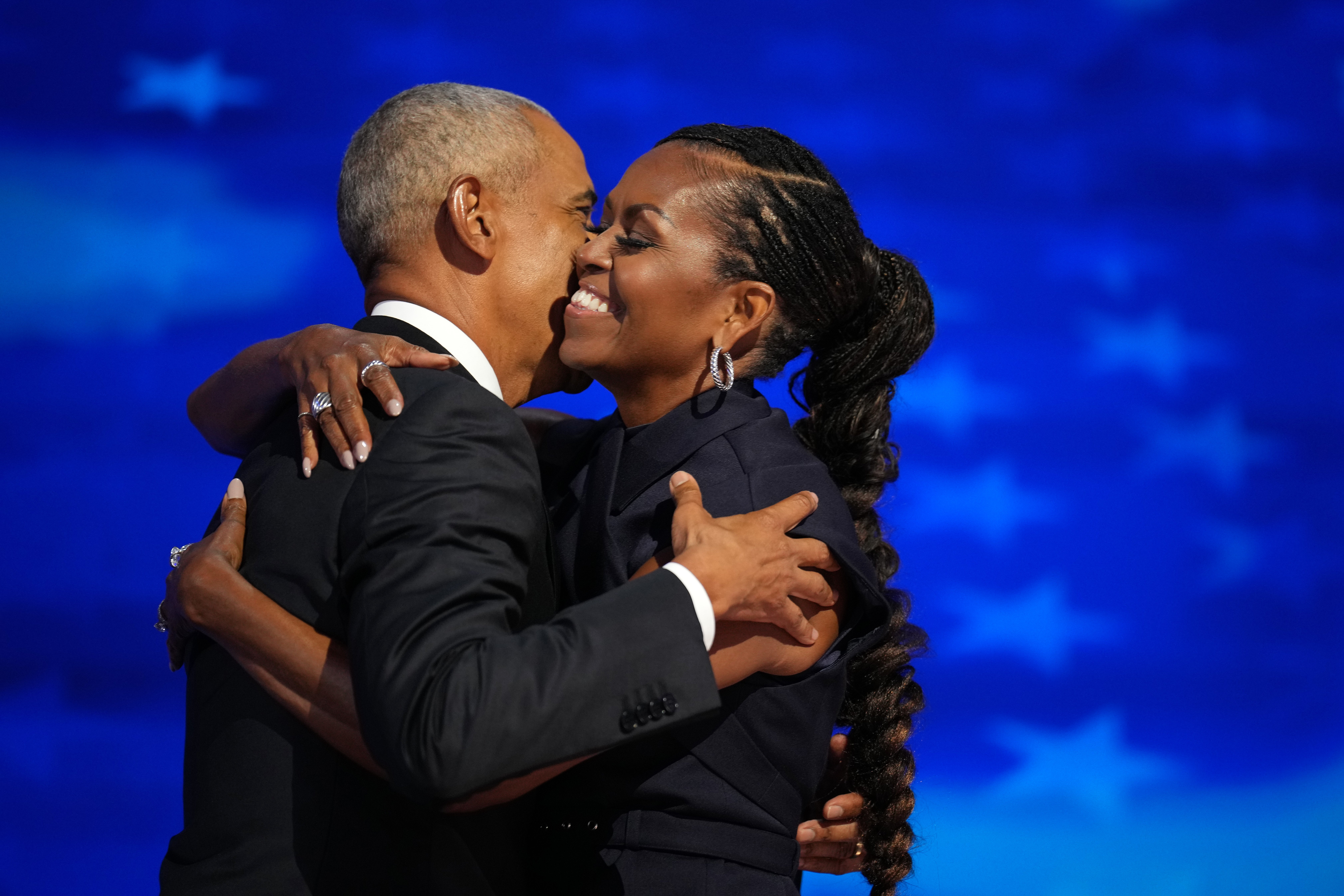 Former U.S. President Barack Obama (L) greets former first lady Michelle Obama as he arrives to speak on stage during the second day of the Democratic National Convention at the United Center on August 20, 2024 in Chicago, Illinois. Delegates, politicians, and Democratic Party supporters are gathering in Chicago, as current Vice President Kamala Harris is named her party’s presidential nominee. The DNC takes place from August 19-22. Image: Getty Images Photo by Andrew Harnik/Getty Images